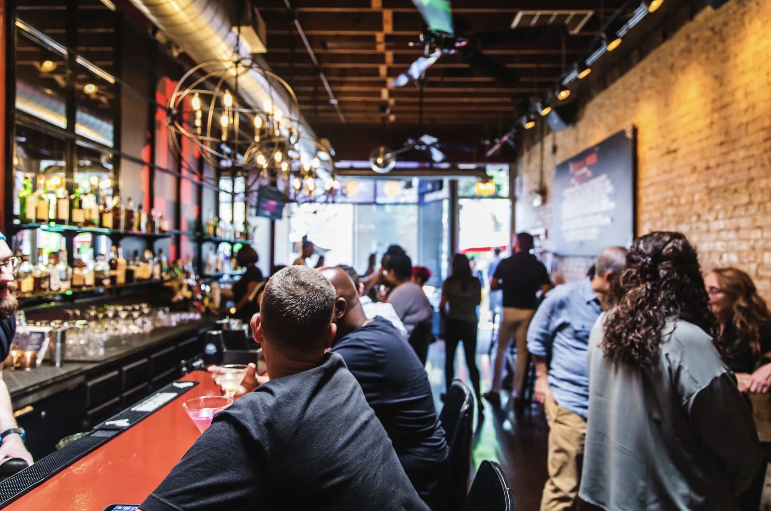 Nobody's Darling busy bar interior with guests and warm lighting