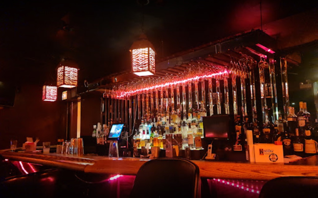 Zebra Lounge low-lit bar with red accent lighting